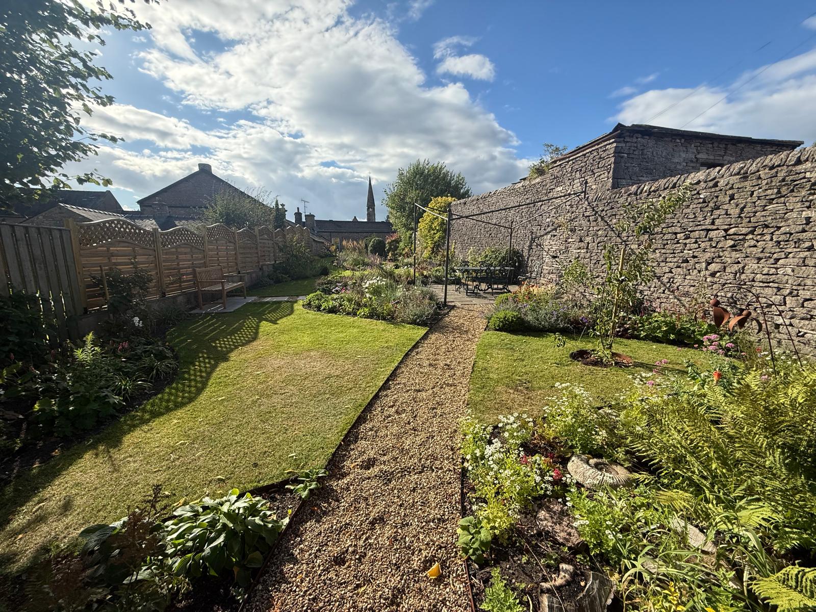 A corten steel edged path with gravel finish for a private client in Lancashire, planting and soil correction. Landscaping by Ribble Landscapes Preston