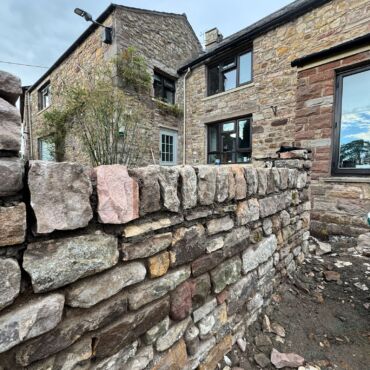Natural sandstone front wall constructed on a property in Greenhalgh, Lancashire